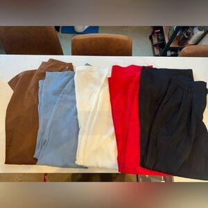 5 pairs of work trousers in red, blue, orange, black and white. All size medium